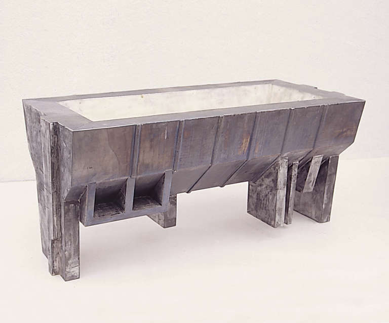 Mansarda  © 2000. Plomo, madera, cera :: 42 x 90 x 41 cm.
